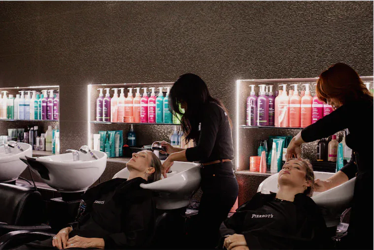 Guests receiving a wash and scalp treatment at basin stations, Pierrot's Hair & Brow Studio, Mount Lawley.